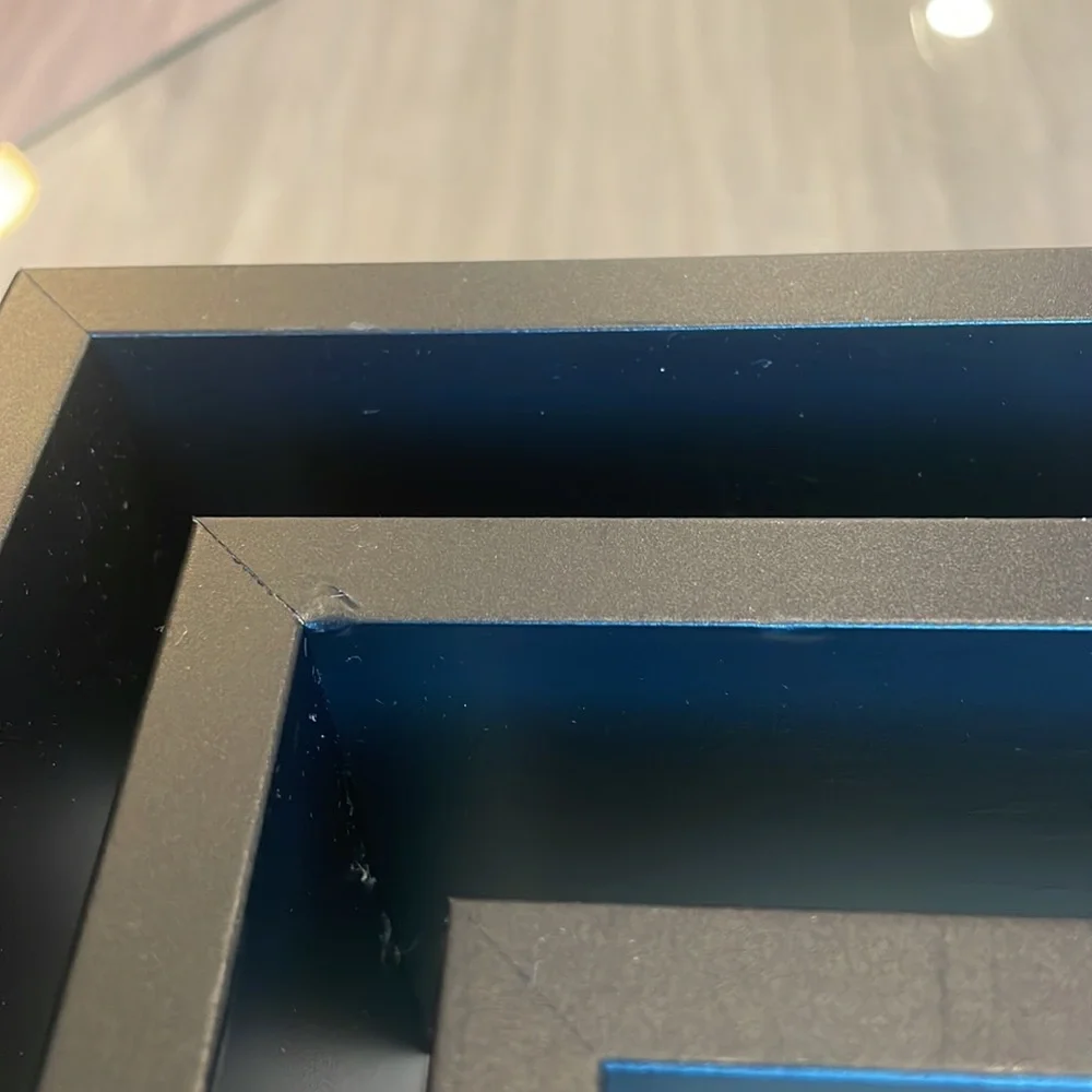 3 black shelving units